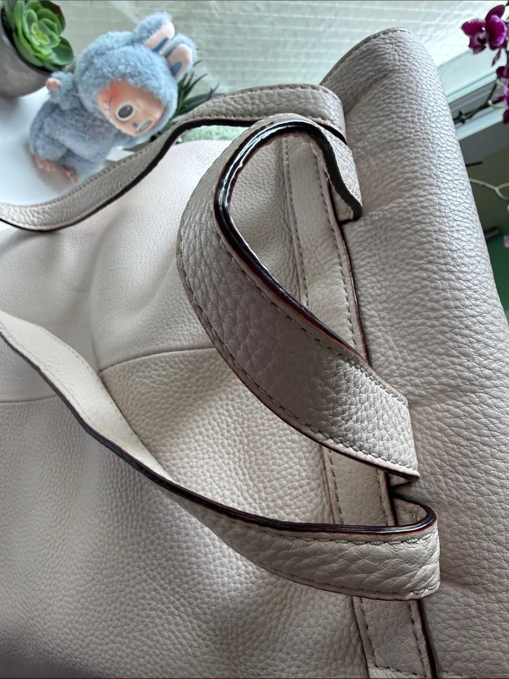 kate spade Pebbled Cream Leather Backpack with Tassel Accents